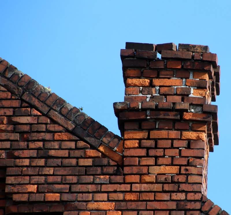 Signs Your Richardson Home Needs a Chimney Inspection Damaged chimney on an Richardson home showing cracks and missing mortar